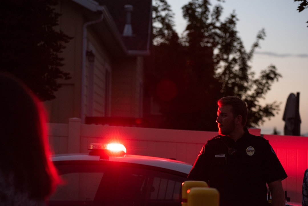 (Niki Chan Wylie |Special to The Tribune) Officer Jeff Petersen guards the gated entrance as a police team works on detonating explosive material found inside a home in South Jordan on Friday, July 24.