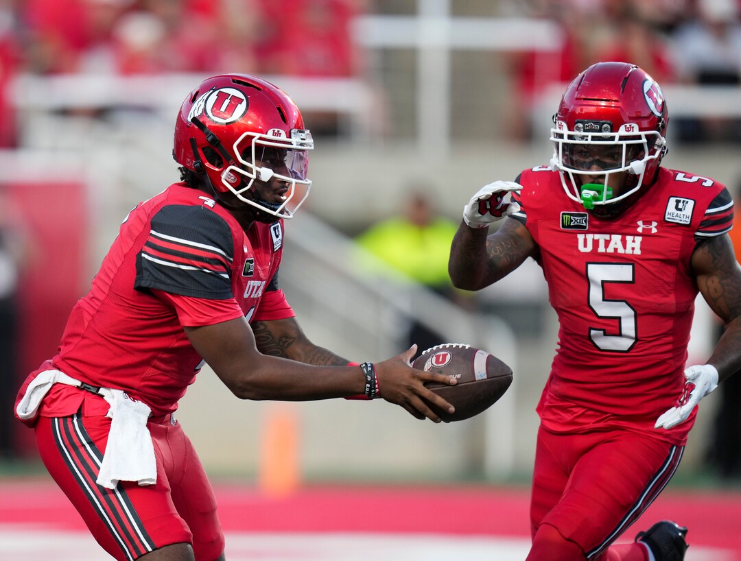 (Bethany Baker  |  The Salt Lake Tribune) Utah Utes quarterback Devon Dampier (4) hands the ball off to Utah Utes running back Daniel Bray (5) during the first half of the game between the Utah Utes and the Idaho Vandals at Rice-Eccles Stadium in Salt Lake City on Thursday, Sept. 3, 2026.