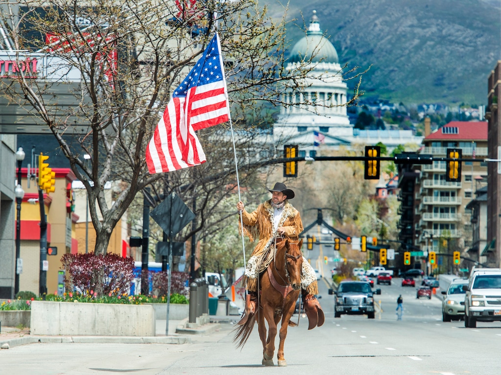 (Rick Egan | Tribune file photo) Couy Griffin from New Mexico rides his horse down State Street in Salt Lake City, Thursday, April 16, 2020. Griffin was arrested Jan. 17, 2021 on charges of illegally entering the U.S. Capitol on Jan. 6.