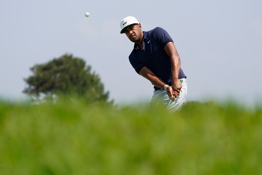 (Jae C. Hong | AP) Tony Finau chips onto the fifth green during the first round of the U.S. Open Golf Championship, Thursday, June 17, 2021, at Torrey Pines Golf Course in San Diego.