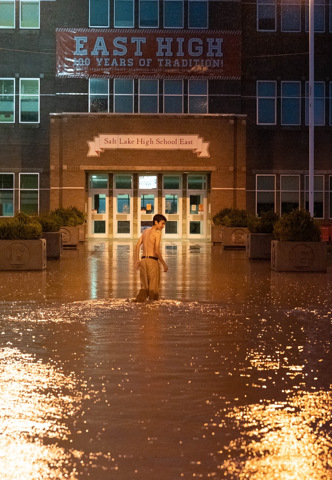 (Francisco Kjolseth | The Salt Lake Tribune) East High student Jack Atkinson, 15, who is starting 10th grade this fall checks out the flooding at his school following a torrential downpour on Sunday, Aug. 1, 2021.