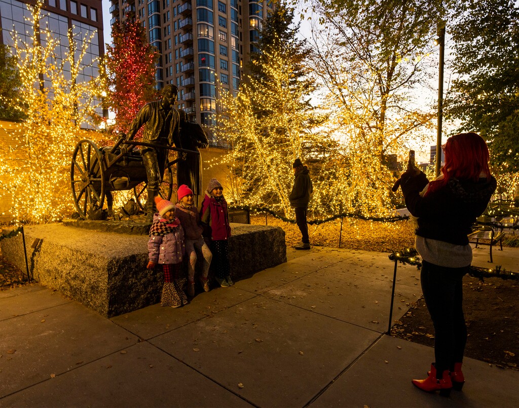 (Rick Egan | The Salt Lake Tribune) Visitors look at the lights on Temple Square on Friday, Nov. 25, 2022. The lights will be switched on for the 2023 holiday season on Friday, Nov. 24, 2023.