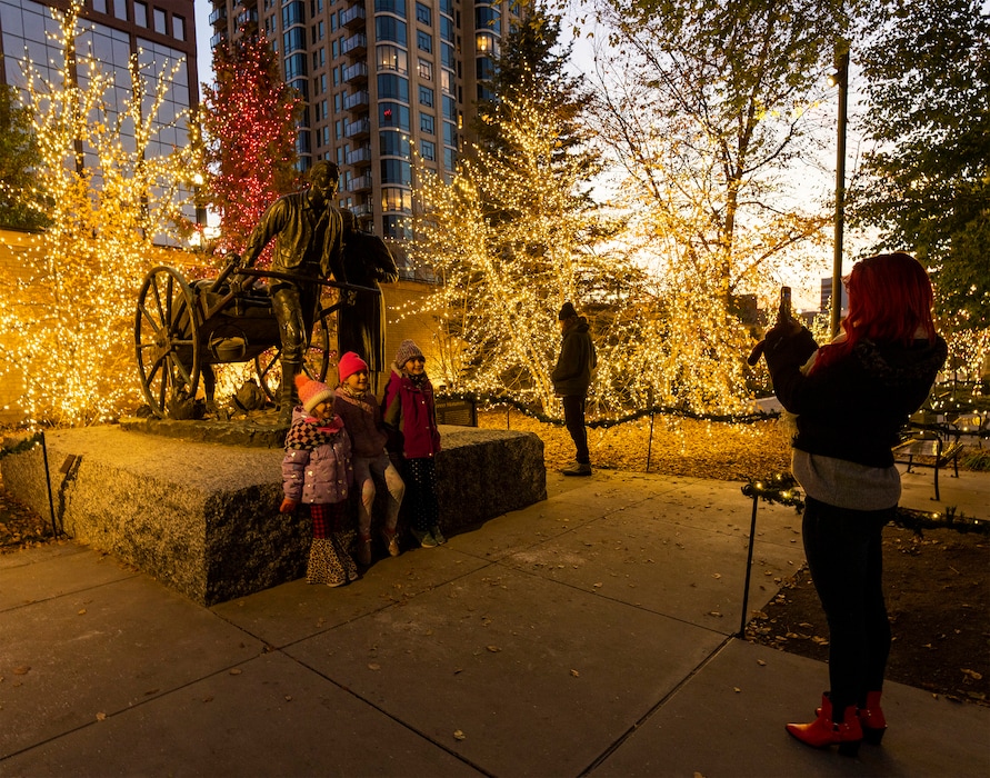 (Rick Egan | The Salt Lake Tribune) Visitors look at the lights on Temple Square on Friday, Nov. 25, 2022. The lights will be switched on for the 2023 holiday season on Friday, Nov. 24, 2023.