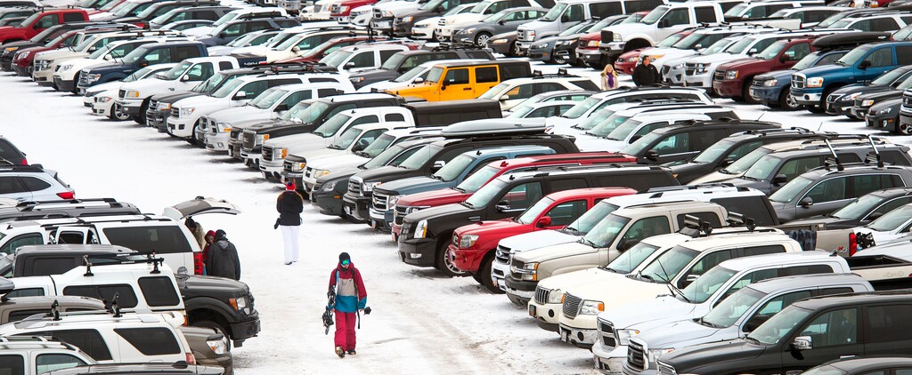 ( Steve Griffin  |  Tribune file photo ) Ski Utah and resort officials are optimistic that another bountiful winter will fill the parking lots of the state's 15 active ski resorts with skiers and snowboarders, just like they did last year when visitation set an all-time record.
Snowboarders walk through a packed parking lot at Solitude Resort in Salt Lake City, Monday, February 15, 2016.