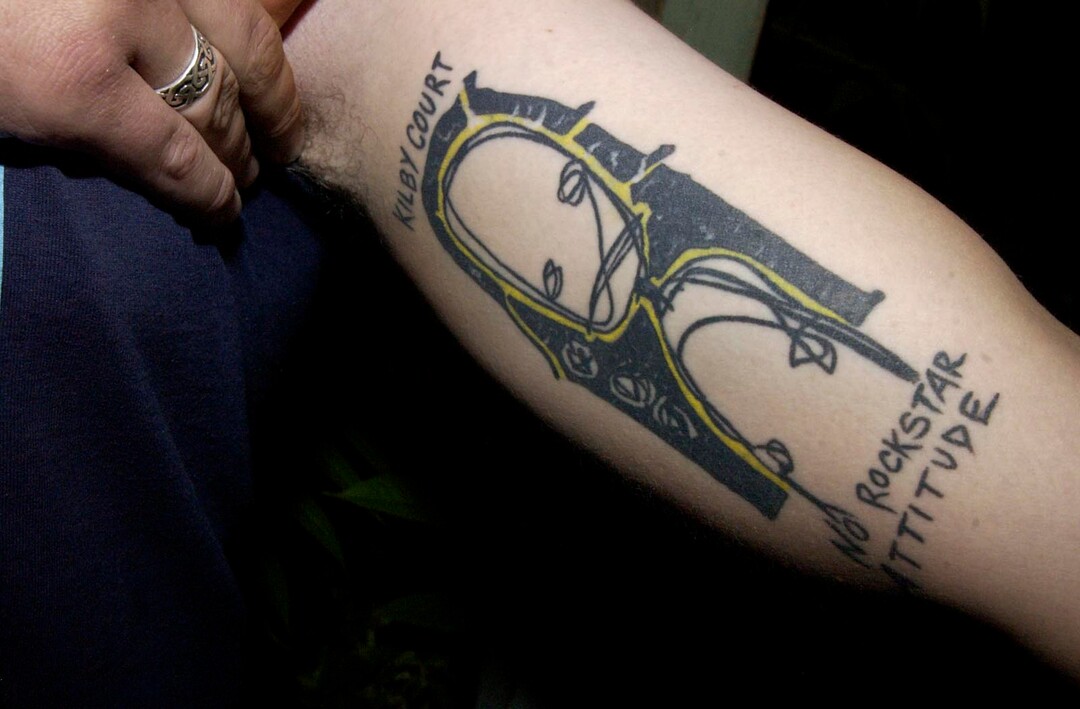 (Ryan Galbraith  |  Tribune file photo)  In this 2004 file photo, a tattoo on the arm of Kilby Court employee Mike Snider. Salt Lake City's all-ages music venue turns 20 this year.