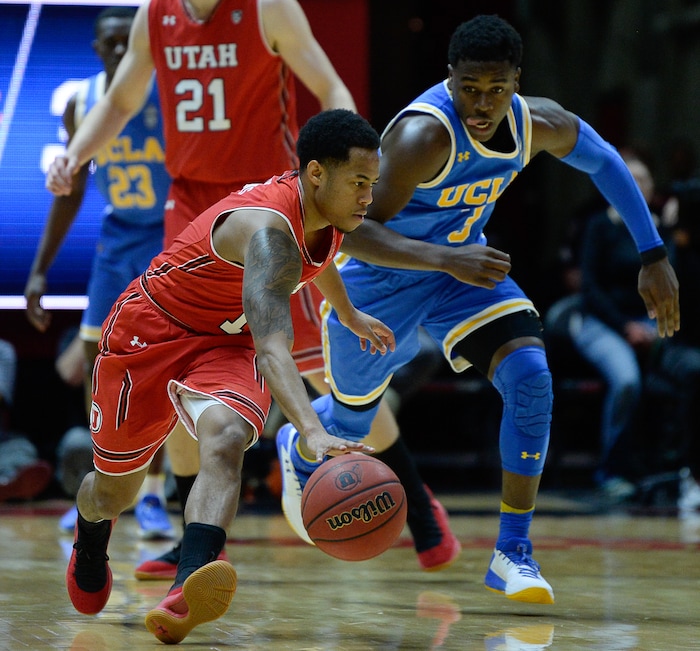 (Francisco Kjolseth  |  The Salt Lake Tribune)  Utah Utes guard Justin Bibbins (1) chases down a ball ahead of UCLA Bruins guard Aaron Holiday (3) as the University of Utah hosts UCLA in NCAA basketball at the Huntsman Center in Salt Lake City, Thursday, Feb. 22, 2018.