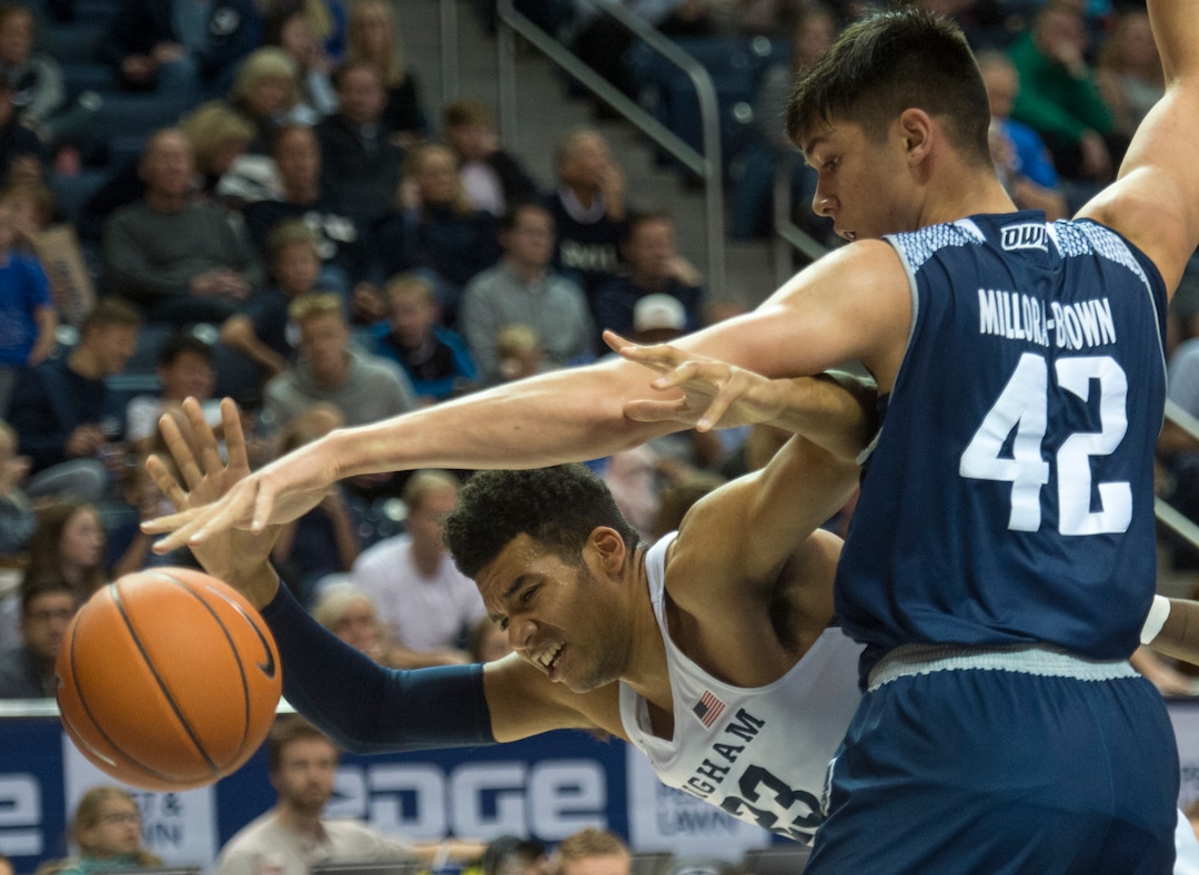 (Rick Egan  |  The Salt Lake Tribune)   Brigham Young Cougars forward Yoeli Childs (23) works for a shot, as Rice Owls forward Quentin Millora-Brown (42) defends, in basketball action between Brigham Young Cougars and Rice Owls, at the Marriott Center in Provo, Wednesday, Nov. 21, 2018.