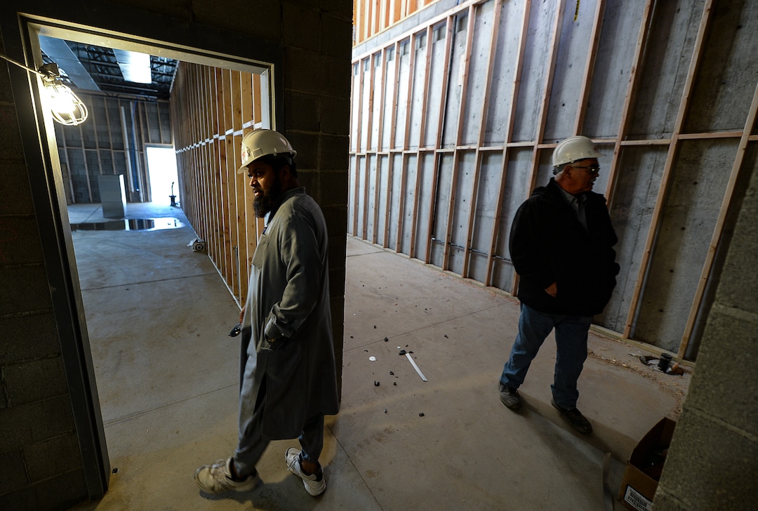 (Francisco Kjolseth  |  The Salt Lake Tribune)  Imam Shuaib Din is joined by superintendent Todd Burt as they tour the site of the half-finished mosque going up in West Jordan at 984 W 9000 South on Tuesday, Oct. 1, 2019. The bottom floor will consist of a large multi-purpose room for overflow and rental space as a banquet hall.