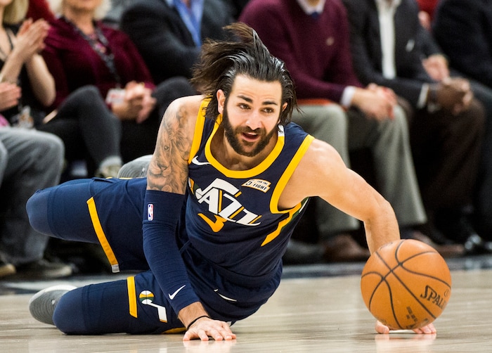 (Rick Egan  |  The Salt Lake Tribune)  Utah Jazz guard Ricky Rubio (3) tries to a get the ball back as he is knocked to the ground, in NBA action Utah Jazz vs Cleveland Cavaliers, in Salt Lake City,  Saturday, December 30, 2017.


