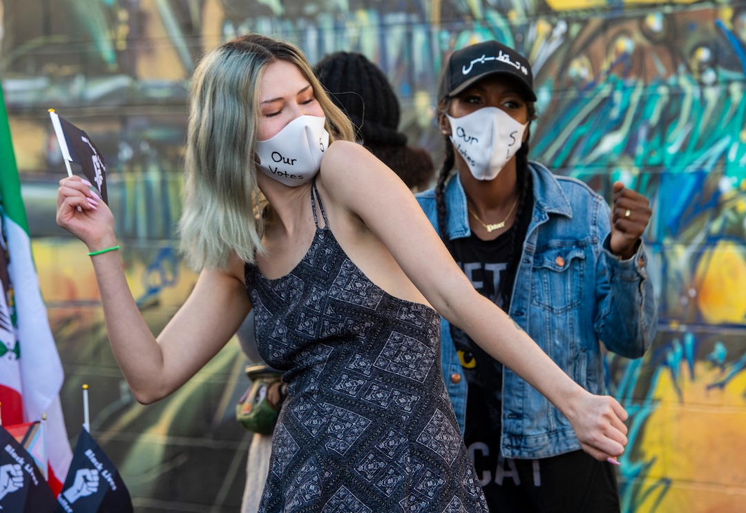 (Rick Egan | The Salt Lake Tribune)  Due to the jump in Covid-19 cases, OurstreetsSLC and Dance Dance 4 Revolution organizers, dance as they stream their virtual "March to the Polls" event from a back alley in Salt Lake City, Sunday, Nov. 1, 2020.