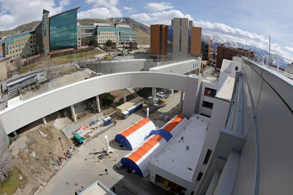 (AP Photo/Rick Bowmer) Negative pressure tents, center, are shown outside the University of Utah Hospital, Monday, March 9, 2020, in Salt Lake City. The tents allow people to be tested for coronavirus without having to go inside the hospital building.
