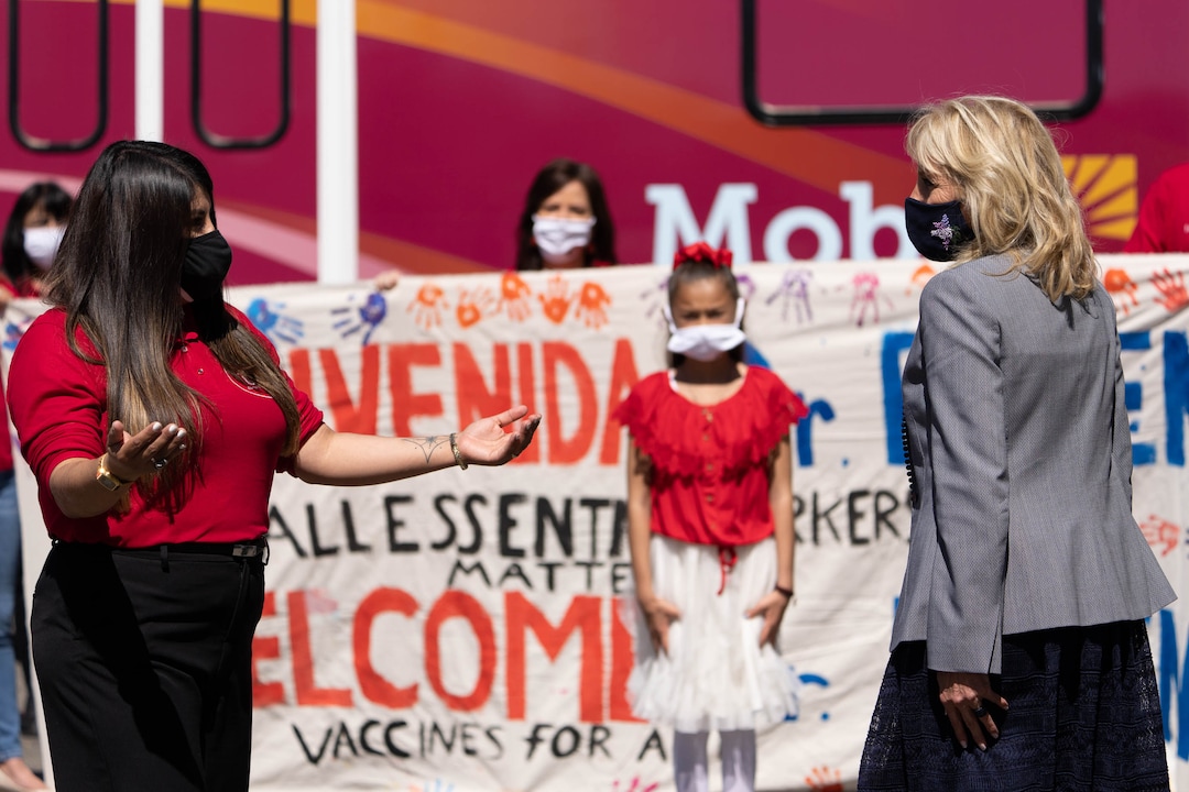 (Francisco Kjolseth | The Salt Lake Tribune) Mayra Cedano, Executive Director of Comunidades Unidas  welcomes first lady Jill Biden as she visits a pop-up COVID-19 vaccine clinic in Jordan Park on Salt Lake City’s west side on Wednesday, May 5, 2021, during her quick visit to Utah as part of a three-state tour.