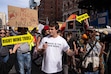 (Adam Gray | The New York Times) The YouTuber Nick Shirley records himself during the No Kings protest in New York on Oct. 18, 2025. Shirley's breakthrough came about five weeks ago, when he posted a 43-minute video claiming to expose fraud at about a dozen Somali-run day care centers in Minnesota.