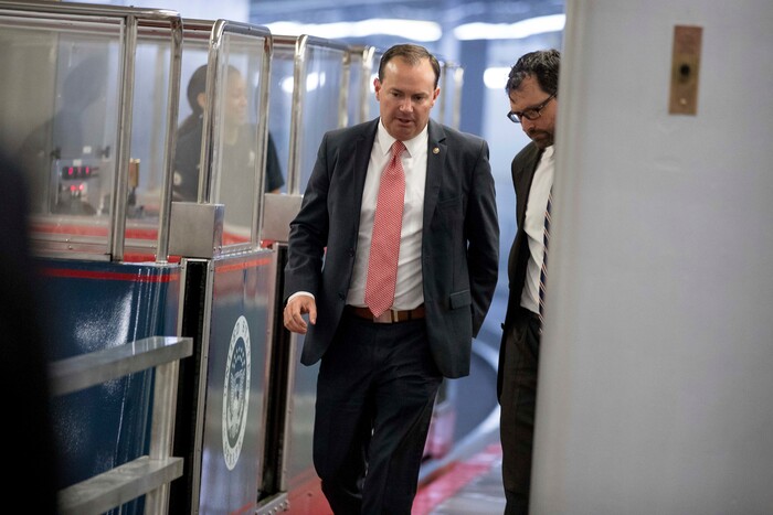 Mike Lee, R-Utah, center, arrives on Capitol Hill in Washington, Tuesday, July 18, 2017. (AP Photo/Andrew Harnik)