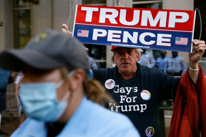 A supporter of President Donald Trump demonstrates outside the Pennsylvania Convention Center, Saturday, Nov. 7, 2020, in Philadelphia, after Democrat Joe Biden defeated President Donald Trump to become 46th president of the United States. (AP Photo/Rebecca Blackwell)