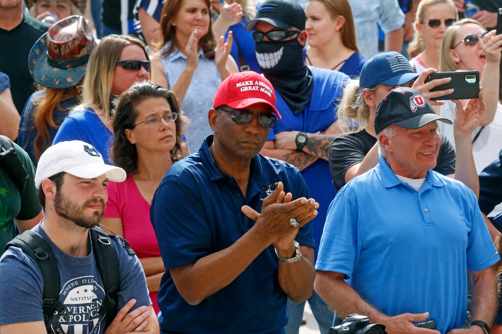 (Rick Bowmer | AP file photo) In this June 20, 2020 file photo, Burgess Owens, center, looks on during a "Blue Rally" to support men and women of law enforcement in Salt Lake City. It appears that Owens has built up an all-but insurmountable lead in his challenge of Utah's only Democrat in Congress, Rep. Ben McAdams, the former mayor of Salt Lake County.