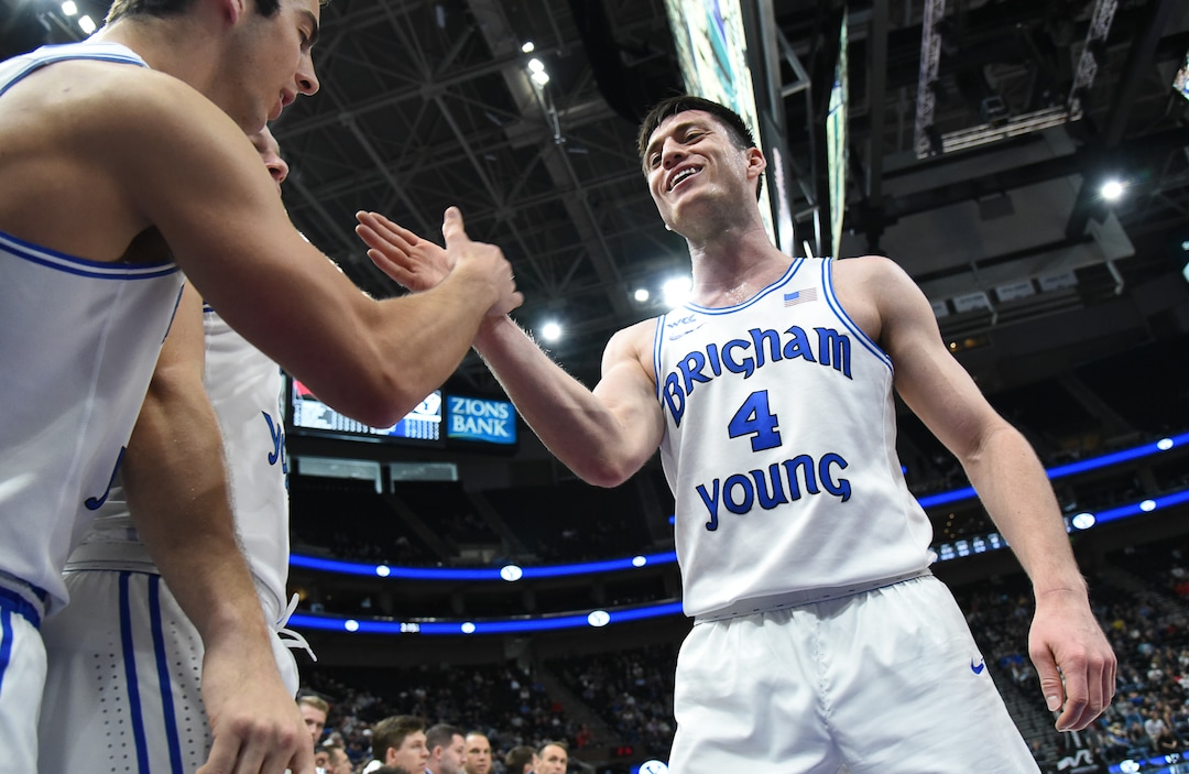 (Francisco Kjolseth  |  The Salt Lake Tribune)  Brigham Young Cougars guard Alex Barcello (4) celebrates with teammates as he is substituted during the second half as BYU takes on UNLV in men's NCAA basketball at Vivint Smart Home Arena in Salt Lake City on Sat. Dec. 7, 2019.
