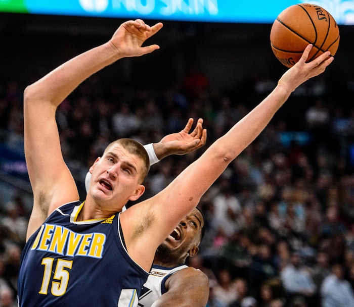 (Trent Nelson | The Salt Lake Tribune)  Denver Nuggets center Nikola Jokic (15) and Utah Jazz guard Joe Johnson (6) as the Utah Jazz host the Denver Nuggets, NBA basketball in Salt Lake City, Wednesday October 18, 2017.