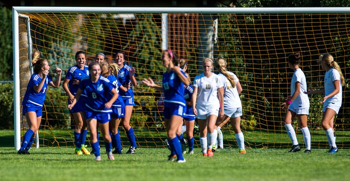 (Chris Detrick | The Salt Lake Tribune) Members of the Fremont soccer team celebrate after scoring a goal on Davis during the game at Angel Street Soccer Complex in Kaysville Thursday, August 24, 2017. Fremont defeated Davis 5-4 in double overtime.