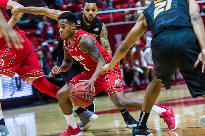 (Chris Detrick  |  The Salt Lake Tribune)  Utah Utes guard Justin Bibbins (1) runs past Missouri Tigers guard Kassius Robertson (3) during the game at the Jon M. Huntsman Center Thursday, November 16, 2017.   