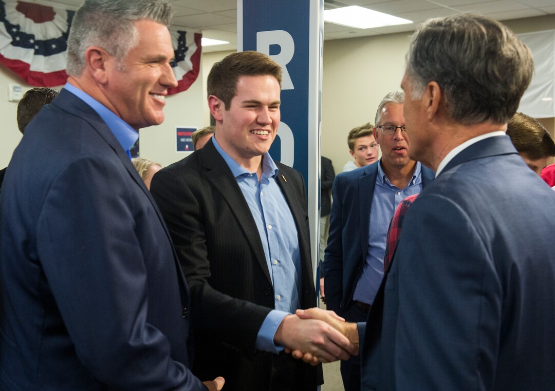 (Rick Egan  |  The Salt Lake Tribune)   Mitt Romney greets Jeff and Jason Hadfield, at the Romney Headquarters, in Orem, as they wait for the polls to close, on election night, Tuesday, Nov. 6, 2018.
