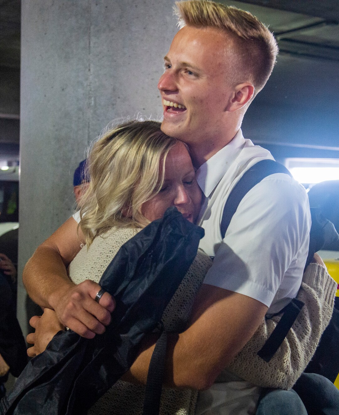 (Rick Egan  |  The Salt Lake Tribune)       Elder Kaden Argyle is welcomed by his mother, Natalie Argyle, from Syracuse, as he returns from the Philippines, at the Salt Lake City International Airport, Sunday, March 22, 2020.