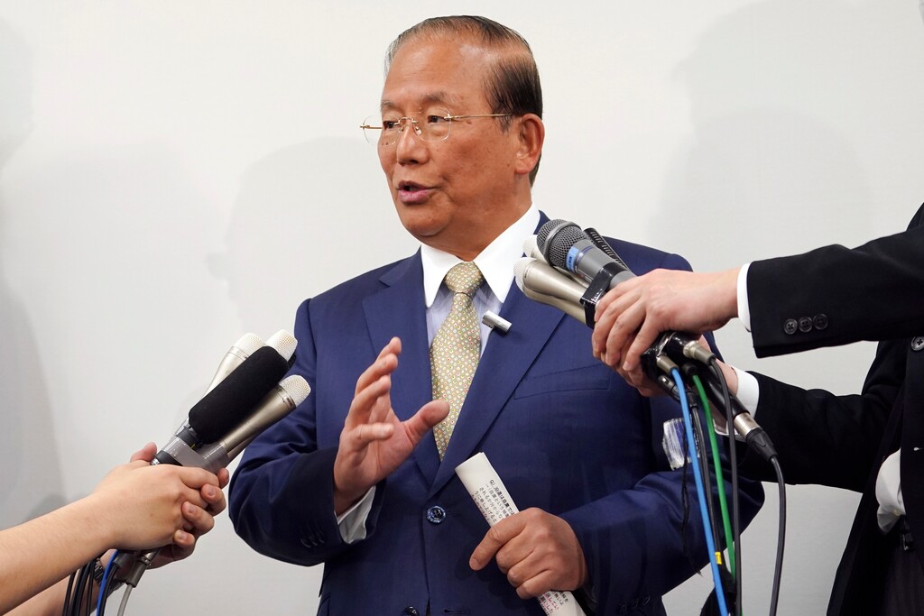 Toshiro Muto, CEO of the Tokyo 2020 Organizing Committee, answers questions during a news conference in Tokyo Tuesday, March 17, 2020. Tokyo Olympic organizers are pushing ahead with the Japanese leg of the torch relay that opens on March 26 despite the threat of the spreading coronavirus. Muto said that crowds will not be prohibited from gathering on the roadside. But he asked for restraint and warned the relay could be stopped or delayed. (AP Photo/Eugene Hoshiko)