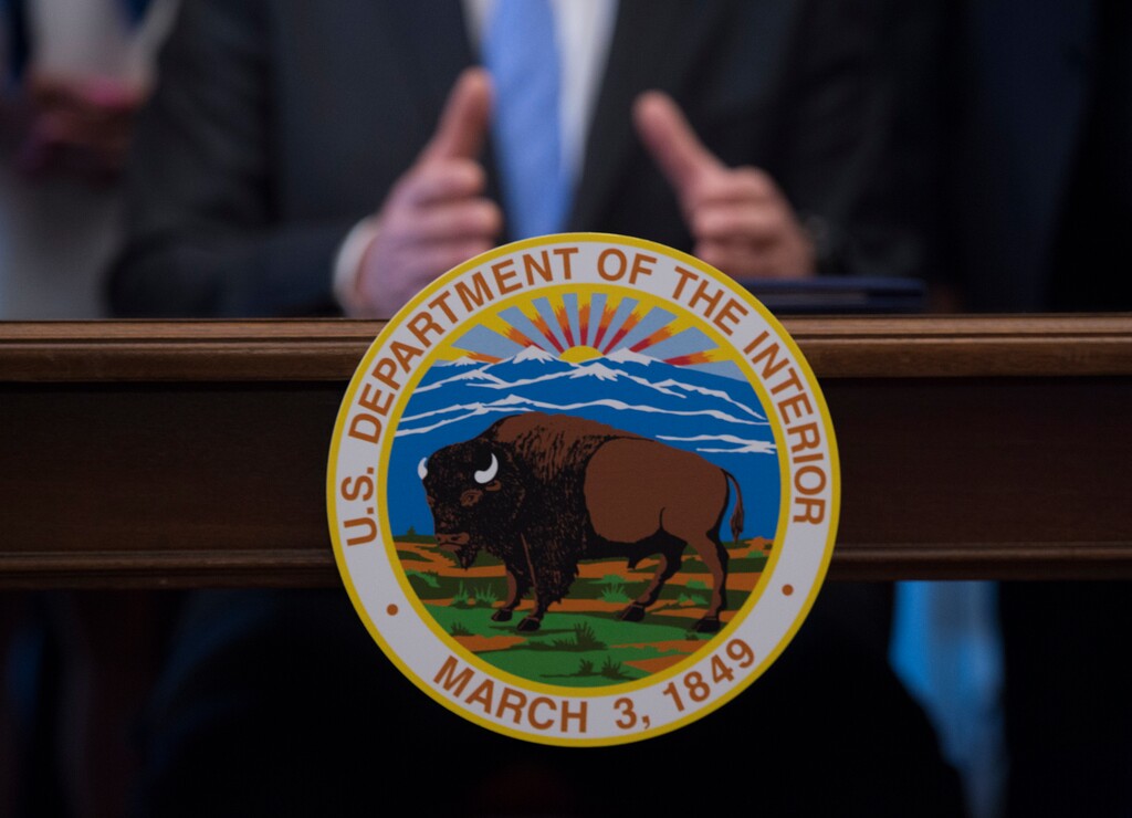 Interior Secretary Ryan Zinke speaks at the Interior Department in Washington, Wednesday, March 29, 2017. Zinke said geographic and physical challenges will make it difficult to build the "big, beautiful wall" that President Donald Trump has promised on the U.S.-Mexico border. (AP Photo/Molly Riley)