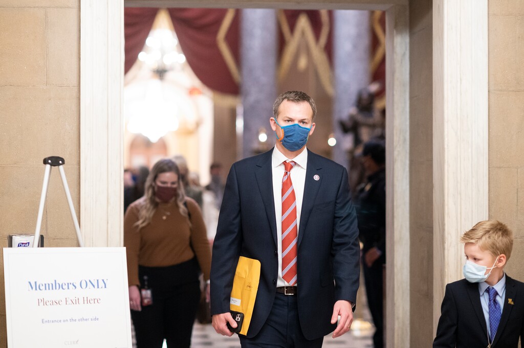 (Bill Clark | CQ Roll Call via AP Images) Rep.-elect Blake Moore, R-Utah, walks through Statuary Hall with his son in the Capitol shortly after being sworn in on Jan. 3.