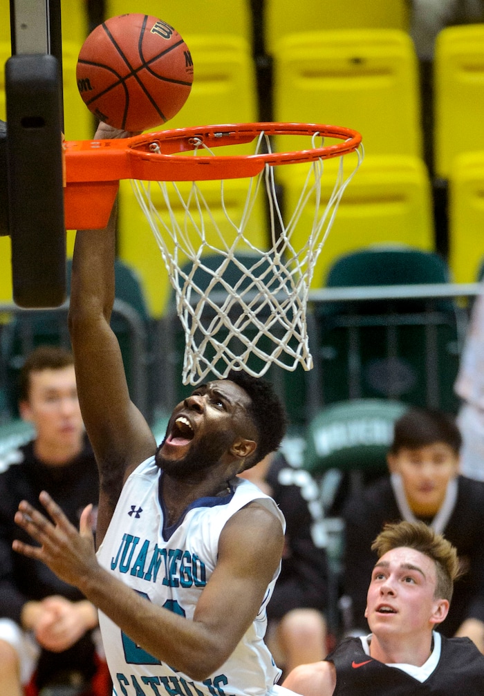 (Steve Griffin | The Salt Lake Tribune) Juan Diego's Jason Ricketts (23) gets to the basket for two points during 4A basketball playoff game against Hurricane at the Utah Valley University’s UCCU Center in Provo Thursday March 1, 2018.