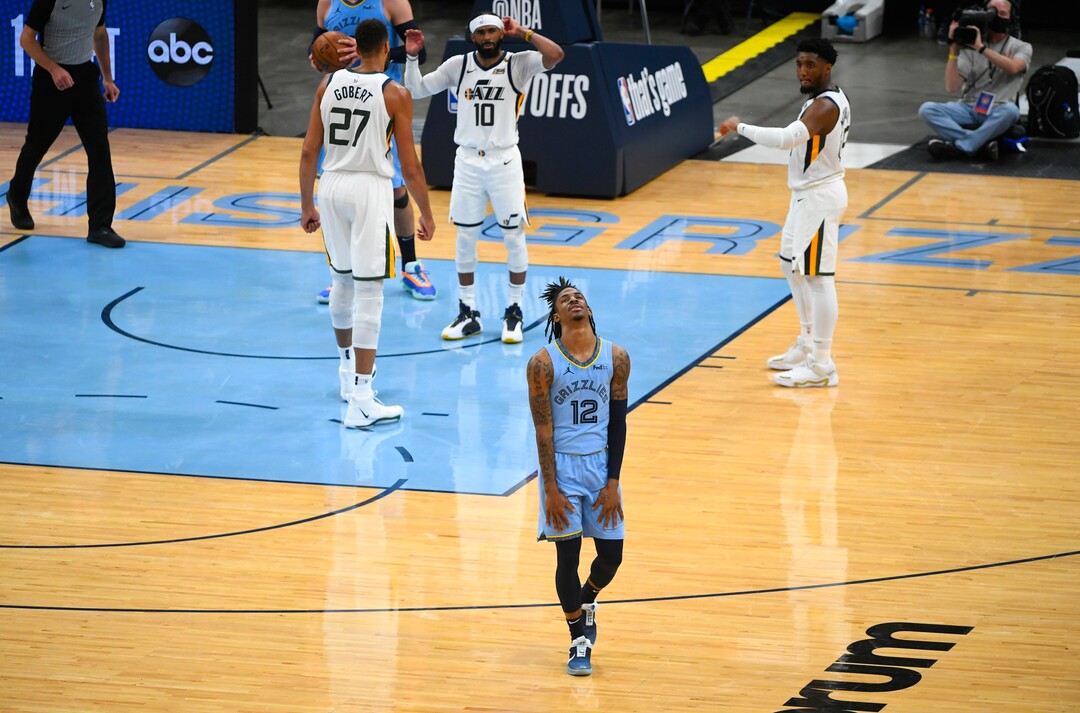 Memphis Grizzlies guard Ja Morant (12) reacts to a missed opportunity during the final minutes of Game 3 of an NBA basketball first-round playoff series against the Utah Jazz, Saturday, May 29, 2021, in Memphis, Tenn. Utah won 121-111.(AP Photo/John Amis)
