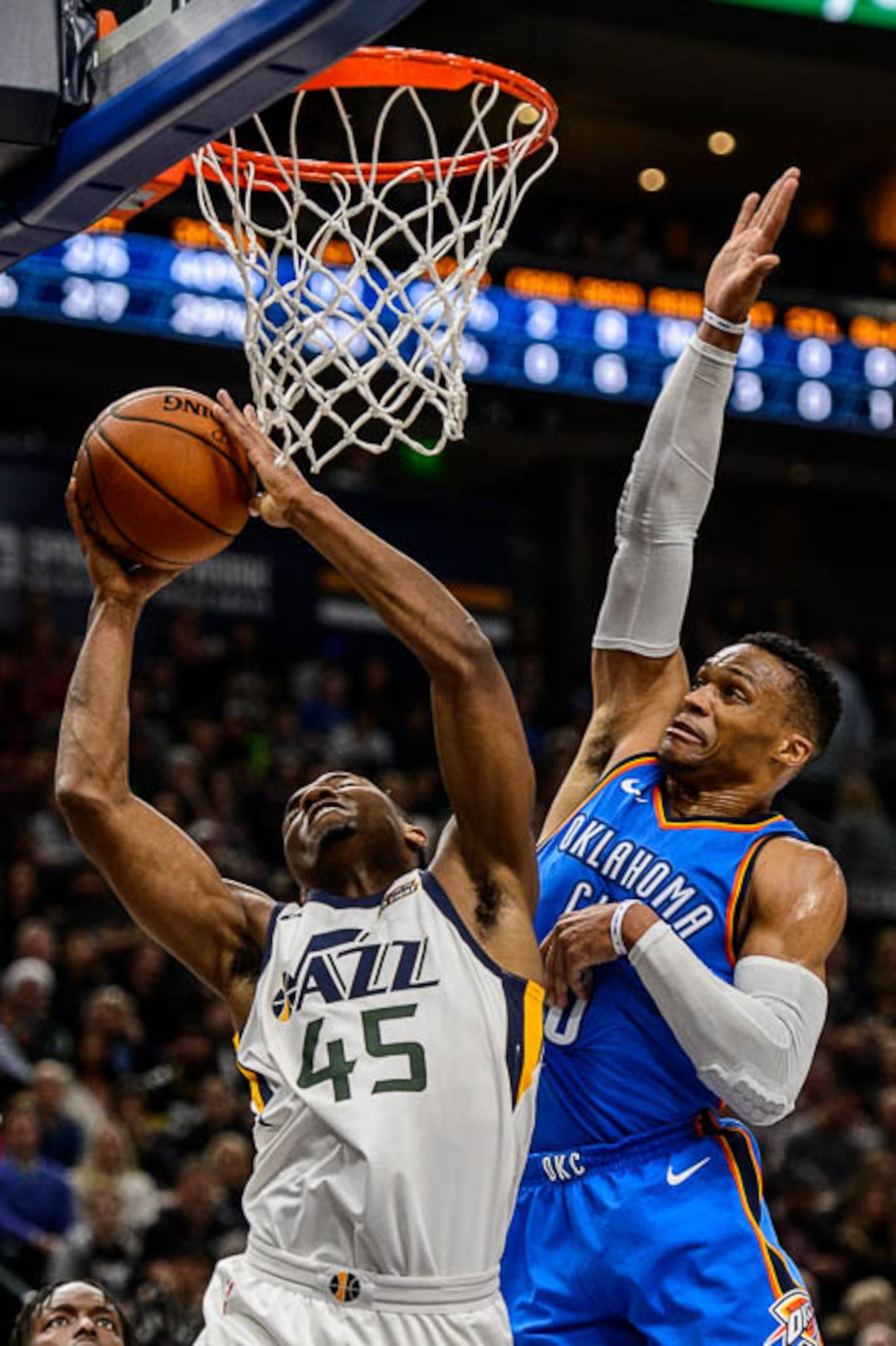 (Trent Nelson | The Salt Lake Tribune)  Utah Jazz guard Donovan Mitchell (45) defended by Oklahoma City Thunder guard Russell Westbrook (0) as the Utah Jazz host the Oklahoma City Thunder, NBA basketball in Salt Lake City, Saturday December 23, 2017.