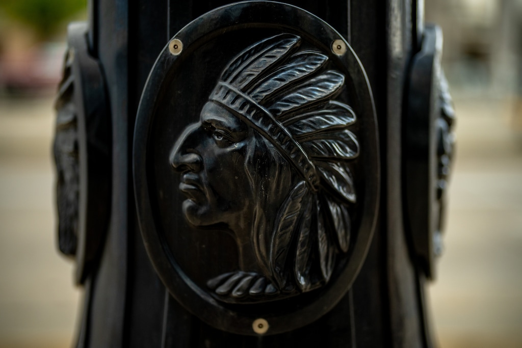 (Trent Nelson | The Salt Lake Tribune) A lamppost in Salt Lake City, bearing a Native American face, on Thursday, Aug. 13, 2026.