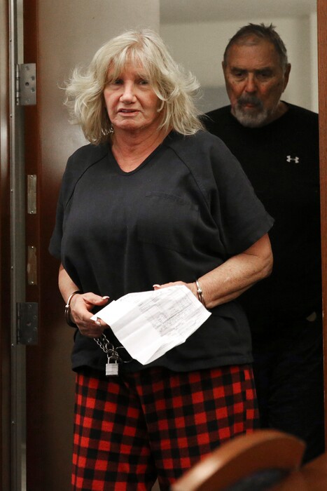 (Erik Verduzco/Las Vegas Review-Journal via AP file)
Patricia Chappuis, left, followed by her husband Marcel, appear in court in February for a hearing at the Regional Justice Center in Las Vegas