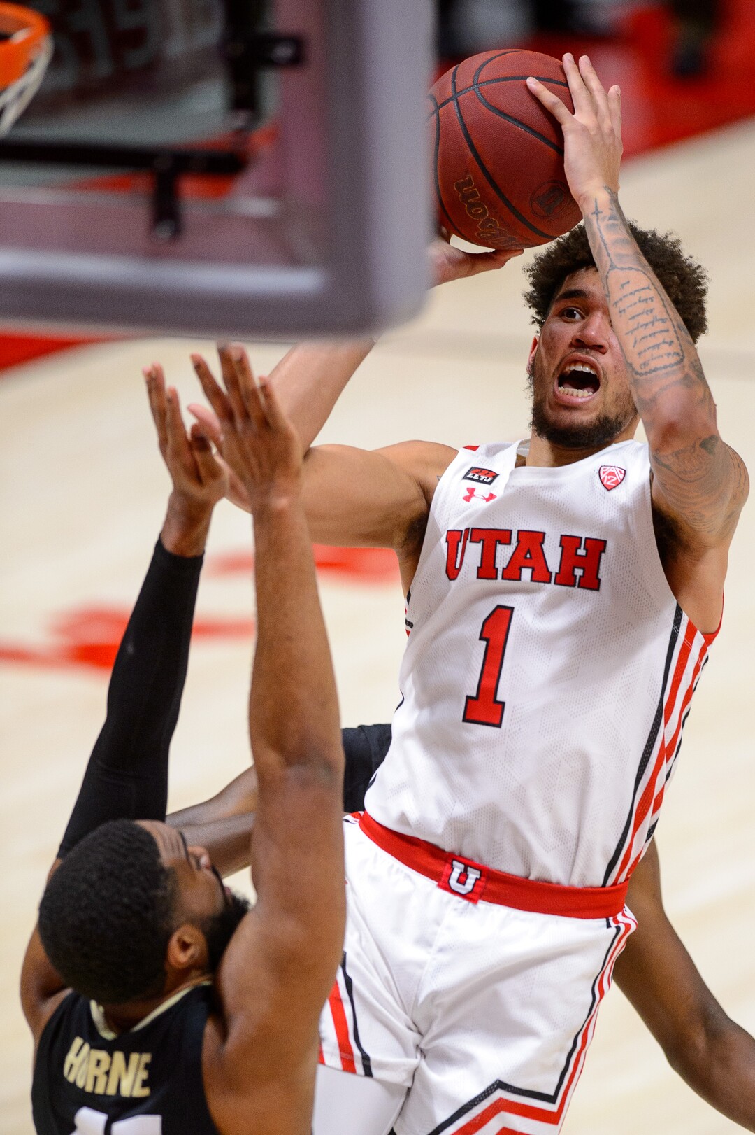 (Trent Nelson  |  The Salt Lake Tribune) Utah Utes forward Timmy Allen (1) shoots over Colorado Buffaloes forward Jeriah Horne (41) as Utah hosts Colorado, NCAA basketball in Salt Lake City on Monday, Jan. 11, 2021.