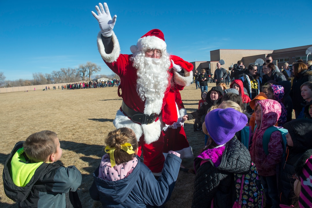 (Rick Egan  |  The Salt Lake Tribune) Santa greets students at Centennial Elementary School, in Roosevelt, Utah, as volunteer pilots from the Utah Wing of Angel Flight West,  brought school supplies and gifts to students in Roosevelt on their annual Santa Flight. Friday, December 8, 2017.