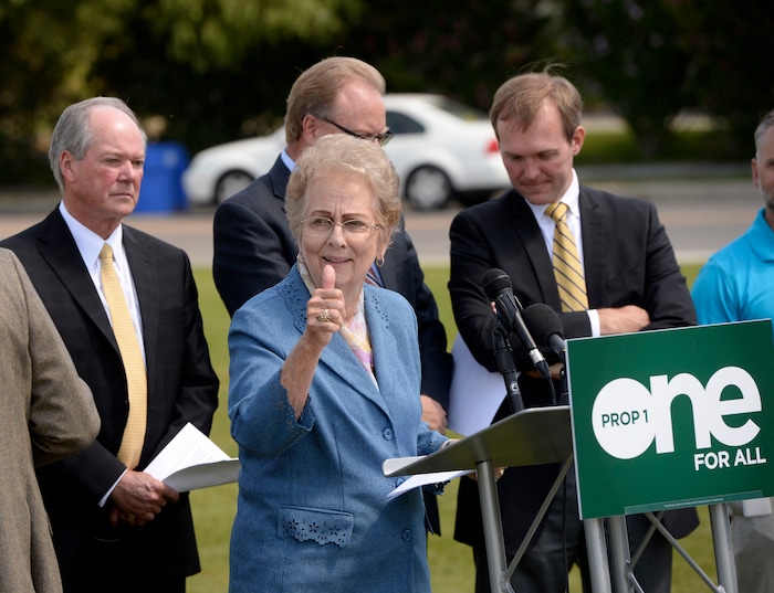 (Al Hartmann  |  Tribune file photo)
Midvale Mayor JoAnn Seghini, center, gives a thumbs up to bicycle transportation advocate as community leaders from northern Utah gather to start a press conference in Midvale Thursday August 27 to launch an "education campaign" for Proposition 1 to raise sales tax by a penny for every $4 in purchases for transportation.
