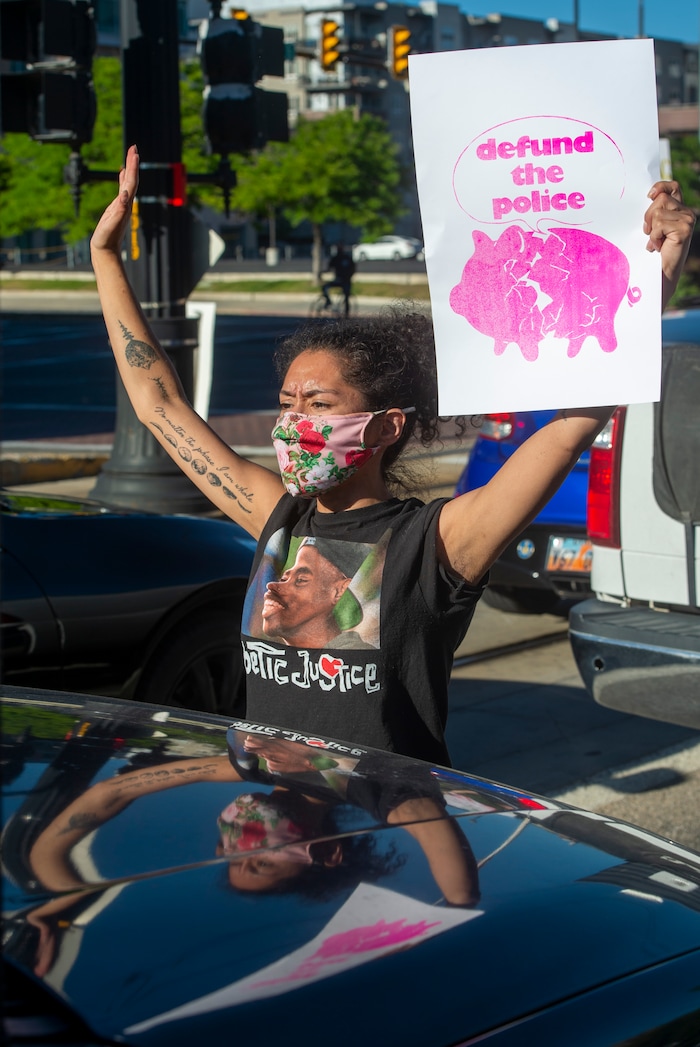(Rick Egan  |  The Salt Lake Tribune) Hailee Hernandez stands in front of a car as protesters block traffic on 400 South in Salt Lake City during a demonstration for Bernardo Palacios-Carbajal on Monday, June 22, 2020.