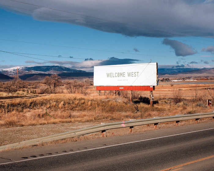 (Elliot Ross | The New York Times) A billboard on the south end of Cody, Wyo., greets travelers on their way into town, on Jan. 28, 2020. Last September, The Cody Enterprise reported that Kanye West bought a property called Monster Lake Ranch, about eight miles outside Cody.