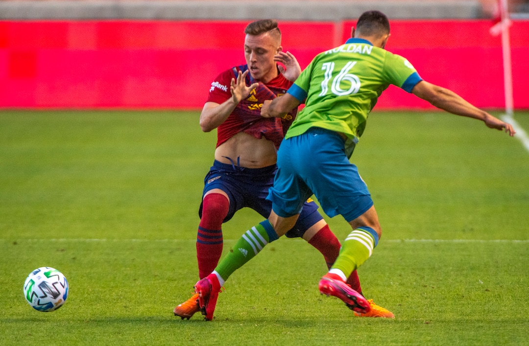 (Rick Egan  |  The Salt Lake Tribune)     Real Salt Lake forward Corey Baird (10) and Seattle Sounders midfielder Alex Roldan (16) go for the ball, in MLS soccer action between Real Salt Lake and the Seattle Sounders, at Rio Tinto Stadium, Wednesday, Sept. 2, 2020.