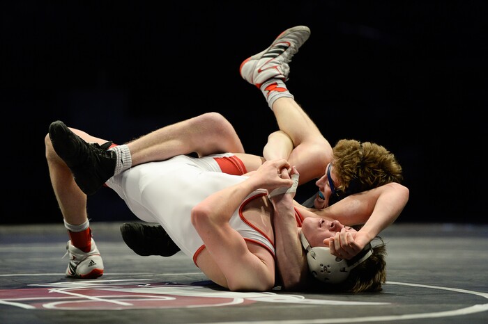 (Francisco Kjolseth  |  The Salt Lake Tribune)  Terrell Barraclough of Layton, top right, puts the moves on Rhett Miner of American Fork in the Class 6A 126 weight class during the state wrestling championship match at the Utah Valley University UCCU Center on Thursday, Feb. 8, 2018.