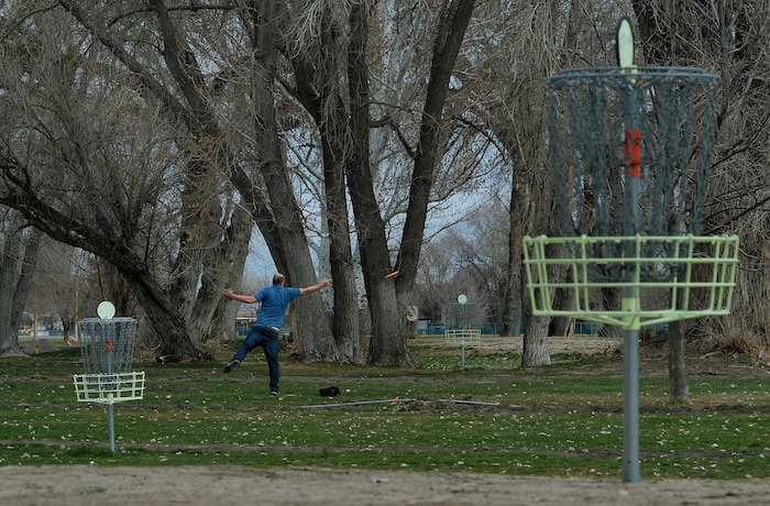 (Francisco Kjolseth  |  The Salt Lake Tribune)  Long time disc golfer Nathan Ottesen of Orem tries out the Roots Disc Golf Course in the Rose Park neighborhood, site of one of the original disc golf courses in Utah before becoming a ball golf course for nearly 20 years. PGA Tour golfer Tony Finau grew up playing the Jordan River Par-3 course that has been converted back to a disc golf venue.