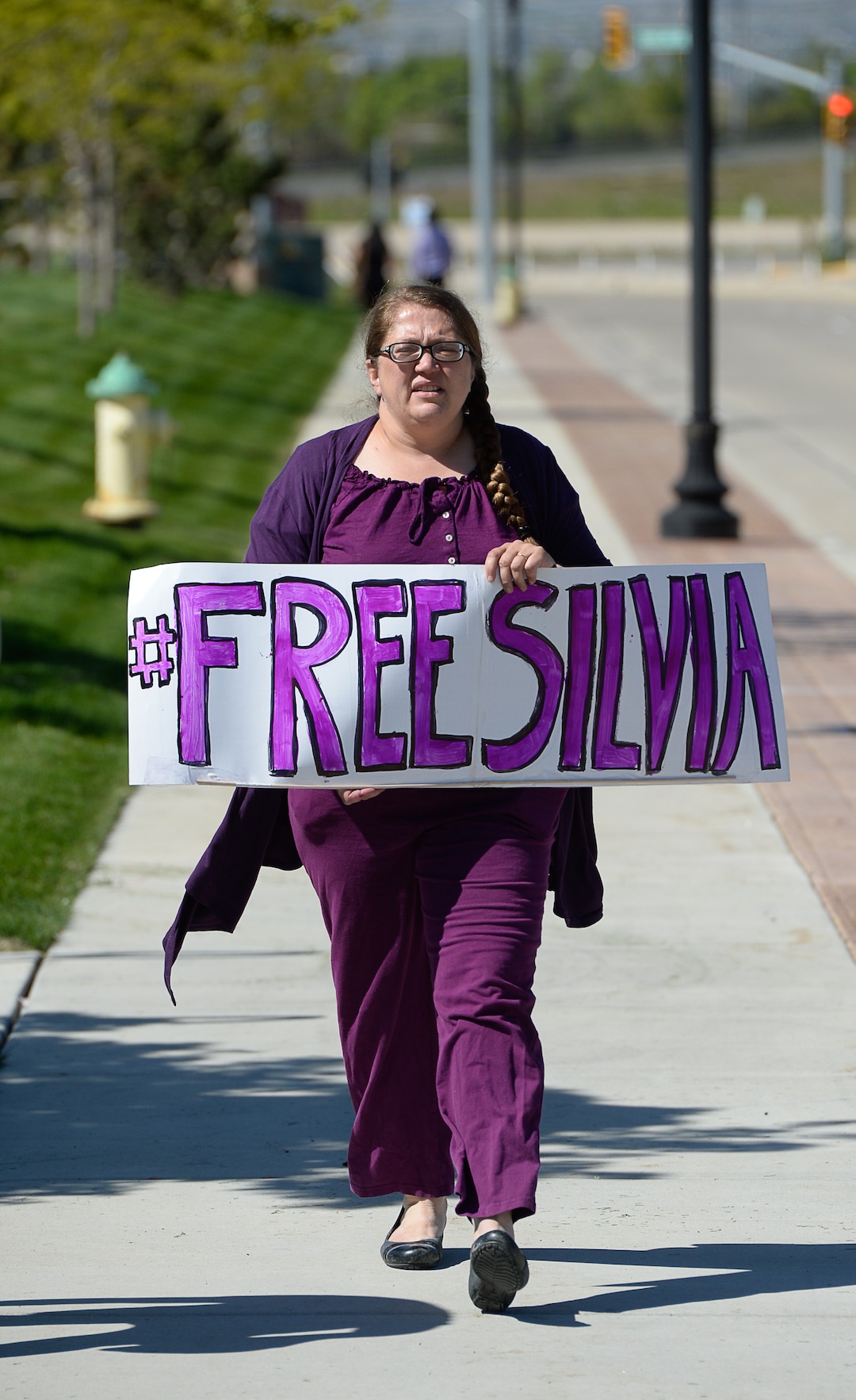 (Francisco Kjolseth | The Salt Lake Tribune)  Dovie Peterson joins Mormon Women for Ethical Government and other concerned citizens as they gather at the Department of Homeland Security field office in West Valley City on Wednesday, May 3, 2017, in a show of solidarity for a young mother named Silvia, who was arrested by ICE agents last week.