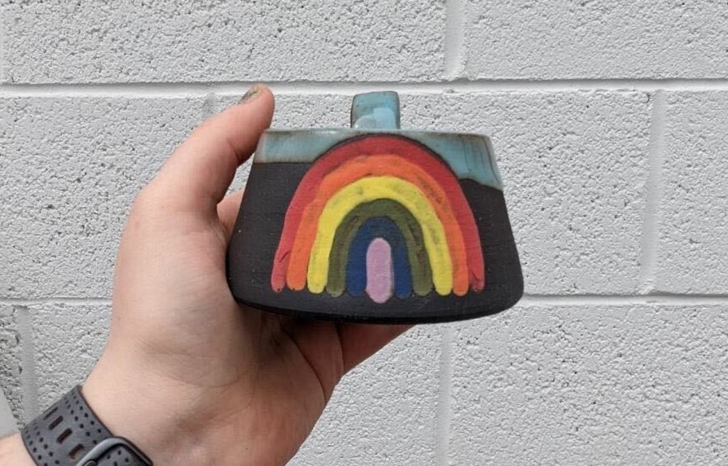 (HB Hadfield) Mugs, like this rainbow design, are the specialty of Utah artist HB Hadfield, who creates under the brand Haybae Art.