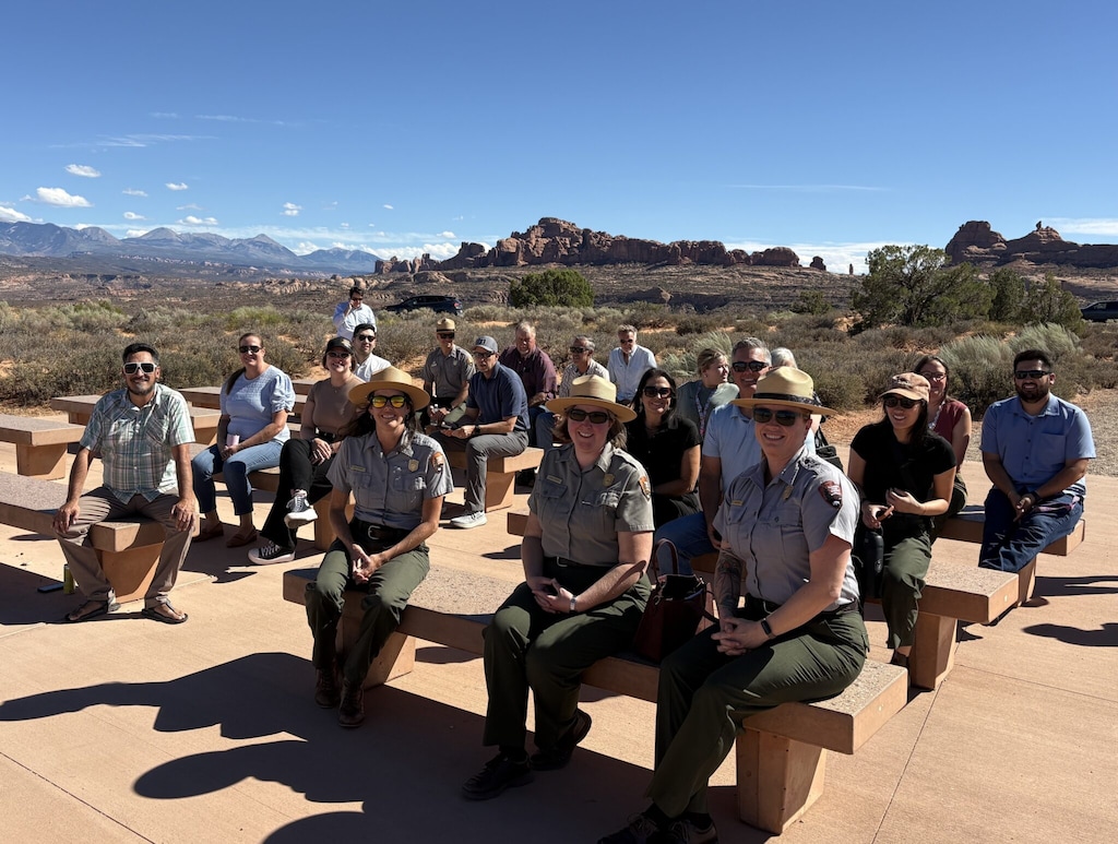 (Andrew Christiansen | The Times-Independent) Federal, state and Grand County officials and other project partners pose for a photo Sept. 8 at Panorama Point in Arches National Park during a ceremony celebrating the Moab-Arches shuttle pilot. The free service began carrying passengers Sept. 1 and officially launched Sept. 9.