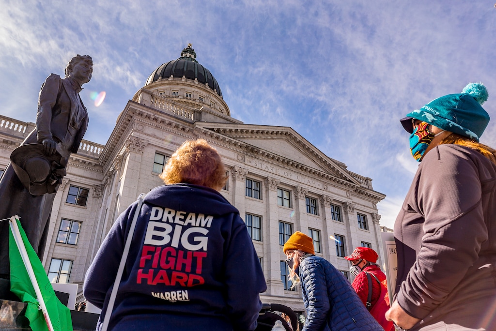 (Trent Nelson  |  The Salt Lake Tribune) People gather in support of the Equal Rights Amendment (ERA) in front of a statue of Martha Hughes Cannon at the state Capitol in Salt Lake City on Tuesday, March 2, 2021.