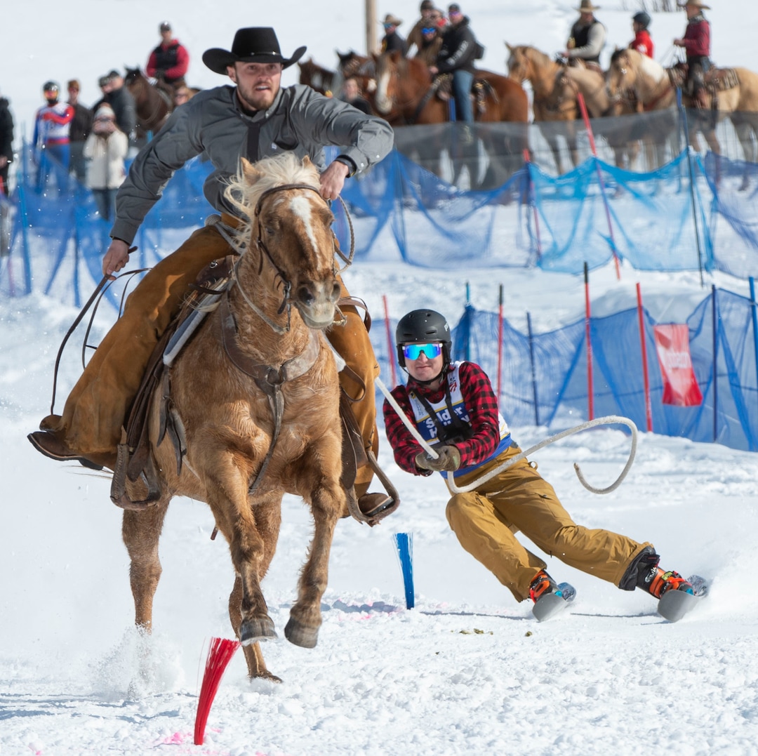 (Rick Egan  |  The Salt Lake Tribune)     Bowen Peterson is pulled by Tyler Olsen on Dandy the horse, for the team "Olsen Ranch", in the  the Skijoring competition at Soldier Hollow Friday.  Feb. 22, 2019.   