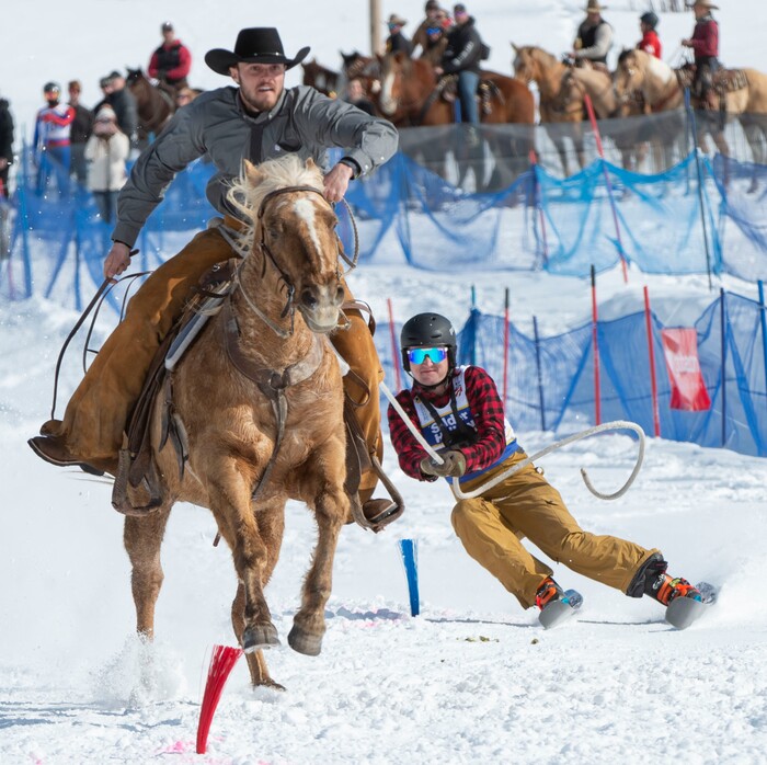 (Rick Egan | The Salt Lake Tribune) Bowen Peterson is pulled by Tyler Olsen on Dandy the horse, for the team "Olsen Ranch", in the the Skijoring competition at Soldier Hollow Friday. Feb. 22, 2019.