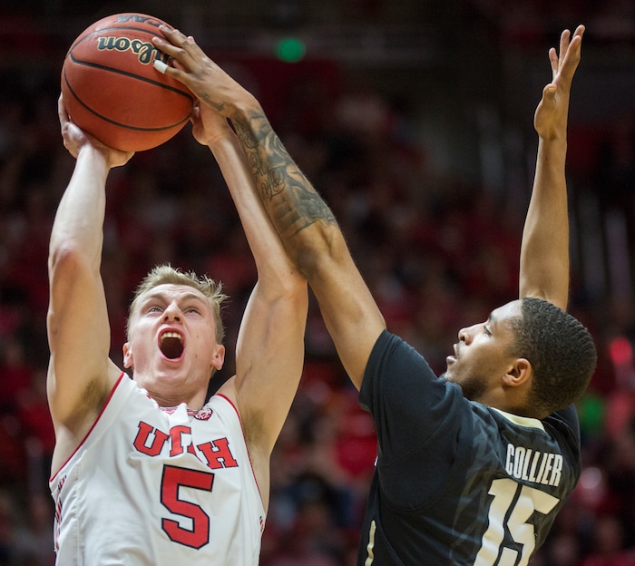 (Rick Egan  |  The Salt Lake Tribune)  Utah Utes guard Parker Van Dyke (5) goes up for a shot, as Colorado Buffaloes guard Dominique Collier (15) defends, in PAC-12 basketball action at the Jon M. Huntsman Center, Saturday, March 3, 2018.