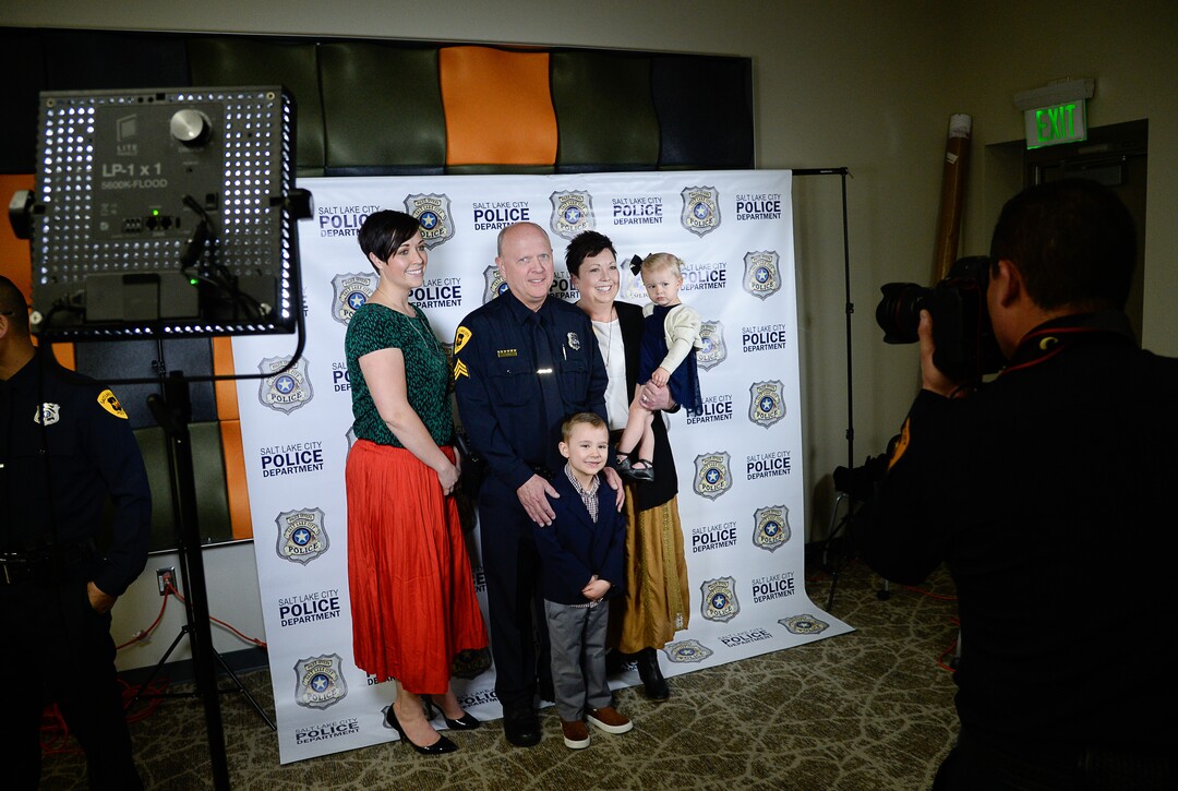 (Francisco Kjolseth  |  The Salt Lake Tribune)  Salt Lake City Airport Police Sgt. Bruce Davies poses for a photograph with his wife Laurie and daughter Ashley Mickelson and her two kids Niall, 4, and Adelynne, 1, following a ceremony to retire the airport police patch and badge as they are subsumed into the Salt Lake City Police Department on Tuesday, Feb. 26, 2019. 